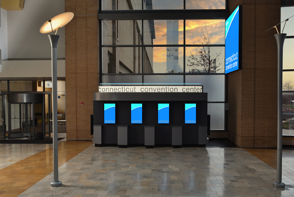 a group of screens in a building